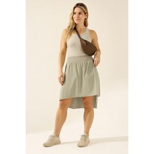 Athleta Cosmic Skirt Womens Large Beige Tan‎ High Low Hem Stretch Pockets Travel